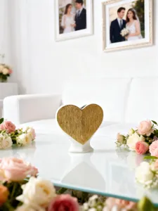 Heart-shaped ceramic vase with gold texture finish, perfect for romantic home floral decor.