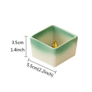 Minimalist square ceramic incense stick holder with gradient green glaze and brass pin.