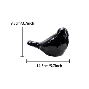 Detail view of the black ceramic bird figurine, showing smooth glaze and precise dimensions.