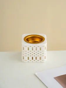 Minimalist 3D printed ceramic incense burner with gold metal bowl for Arabic home decor.
