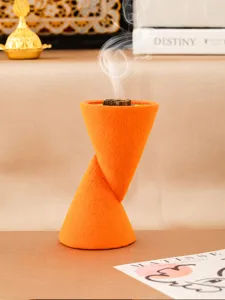 Modern orange double-cone resin incense burner, elegant desktop art ornament for home decor.