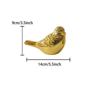 Gold ceramic bird figurine, cute desktop ornament for home decor, art craft display.