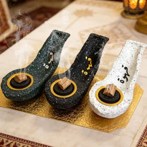 Resin flat boat incense burner with Arabic calligraphy, ideal for home table decor.