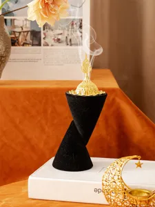 Middle Eastern resin incense burner with creative double cone base and gold dome lid for home decor.