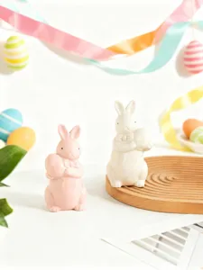 Charming ceramic Easter bunny figurine holding egg with bow tie for home table decor detail