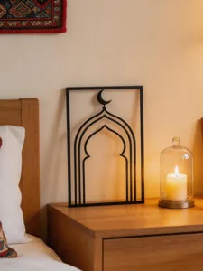 Middle Eastern style black metal wall art featuring mosque arch and crescent moon design for home.