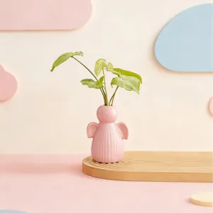 Pink ceramic angel vase for home decor, cute desktop flower arrangement container for room.