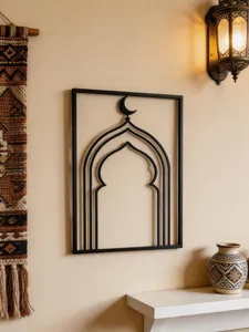 Detailed shot of Arabic iron wall art hanging, Middle Eastern style arch metal decor.