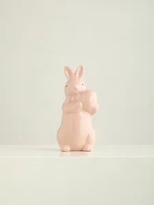 Ceramic easter bunny rabbit figurine detail close up pink table decor cute home ornament