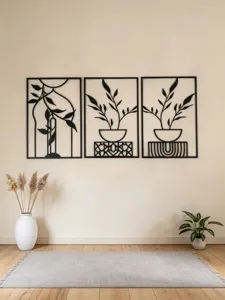 Modern black metal wall art set, minimalist abstract plant leaves hanging decor for home.
