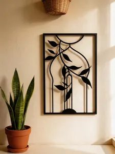 Detailed view of the modern black metal wall art featuring elegant leaf and geometric design.