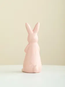 Charming ceramic pink bunny detail view, cute home decor ornament for Easter display.