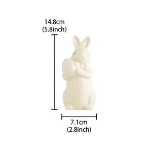 Ceramic Easter rabbit figurine holding an egg with bow tie, cute desktop home decoration ornament.