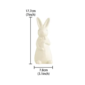 White ceramic Easter rabbit figurine with bow tie and egg, 17.7cm tall desktop decor.