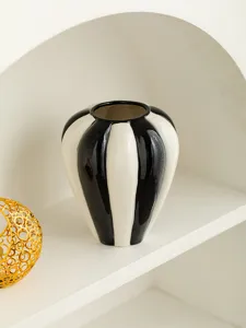 Nordic black and white striped ceramic vase detail view, elegant tabletop decor ornament.