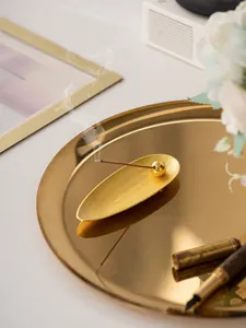 Exquisite golden willow leaf incense burner detail showcasing elegant design and smoke effect.