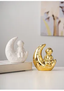 Close up view of the modern creative astronaut moon ceramic ornament details and texture.