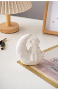 Creative ceramic astronaut moon ornament for modern home desktop bookshelf decor tabletop sculpture