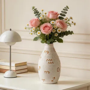 Modern ceramic flower vase with abstract zodiac symbols, elegant desktop decor for home.