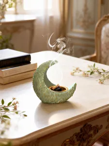 Exquisite resin crescent moon incense burner detail, classical artistic aromatherapy craft for home.