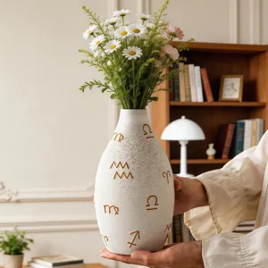 Modern artistic ceramic vase with symbol pattern, elegant desktop flower arrangement for home decor