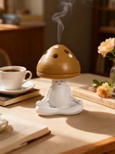 Close-up detail of the cute meditating mushroom incense burner, ceramic craft with smoke.