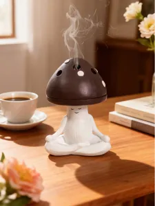Detail view of cute meditation yoga mushroom ceramic incense burner for home aroma decor gift.