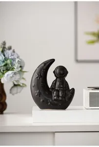 Modern creative astronaut moon ceramic ornament for desktop bookshelf home decor detail view