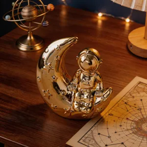 Gold ceramic astronaut moon figurine, modern creative home desktop shelf decor ornament.