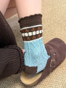 Vintage floral wool knit socks detail shot, cozy mid-tube winter thermal hosiery.