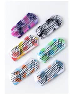 Colorful tie-dye yoga grip socks with non-slip silicone dots for indoor pilates and fitness.