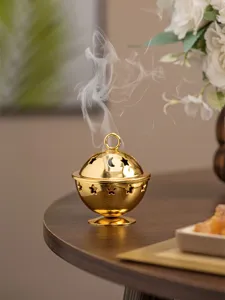 Golden metal incense burner featuring exquisite hollow star and moon patterns for home decor.