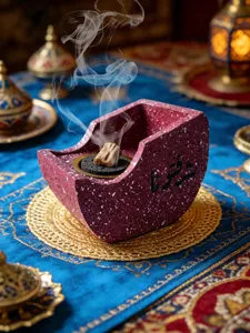 Creative resin boat-shaped incense burner with Arabic calligraphy for beautiful home decor.