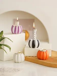 Resin small pumpkin candle holder set for Halloween home and dining table decor display.