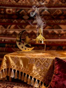 Gold hollow star and moon incense burner, Middle Eastern style Arabic aromatherapy decor detail.