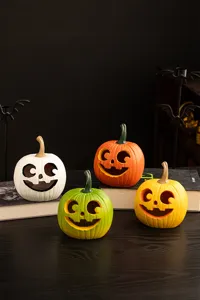 Detailed view of colorful Halloween pumpkin resin ornaments for festive home tabletop decor.