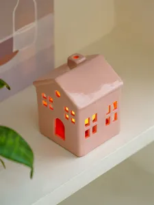 Pink ceramic house candle holder detail closeup modern minimalist home decor accent tabletop