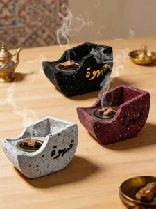 Creative resin boat incense burner with Arabic calligraphy for chic home decoration.