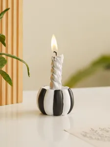 Resin black and white striped pumpkin candle holder detail, perfect Halloween home decor.