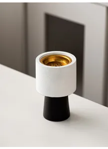 Modern minimalist white and black incense burner with golden brass inner bowl for home decor detail