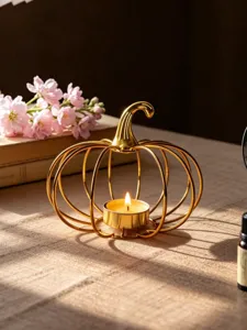Gold iron pumpkin candle holder detail view, perfect for romantic table and harvest festival decor.