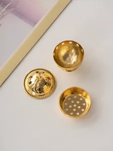 Mini gold metal incense burner detail view, Arabic Middle Eastern style star moon hollow decor.