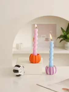 Resin pumpkin candle holder detail view, decorative spiral candle for wonderful autumn decor.