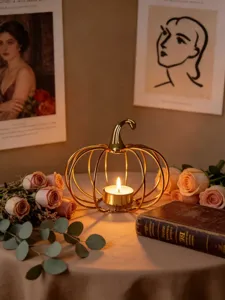 Gold wire pumpkin candle holder detail view, elegant metal design for romantic home decor.