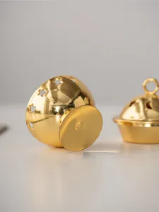 Gold metal incense burner detail, star cutout design, mini Arabic desktop home decor ornament.