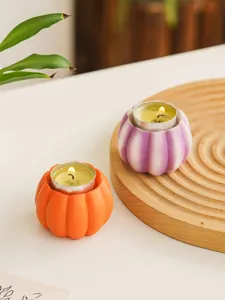Resin pumpkin candle holder detail, cute tabletop decoration for Halloween harvest and restaurant party.