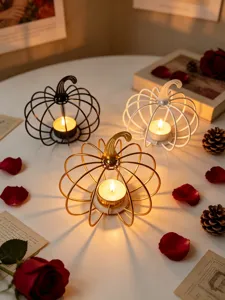 Metal pumpkin candle holder set, modern decorative tealight stand for home, table, and party decor.