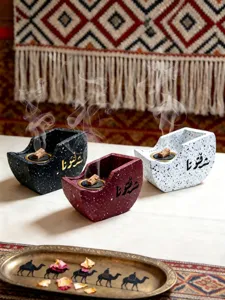 Resin boat-shaped incense burner featuring Arabic calligraphy, creative Arabic home decor.