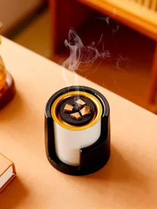 Modern Middle Eastern incense burner detail showing wood grain texture and rising smoke.