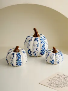 Blue and white porcelain ceramic pumpkin decor set for tabletop and entryway display.